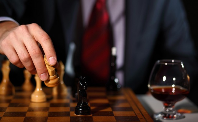 Businessman playing chess